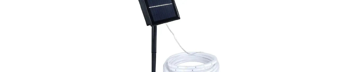 Black solar panel on a ground stake connected to a coiled white flexible LED strip light against a white background
