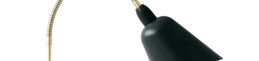 Matte black conical shade on a flexible gold gooseneck arm for a modern desk lamp design