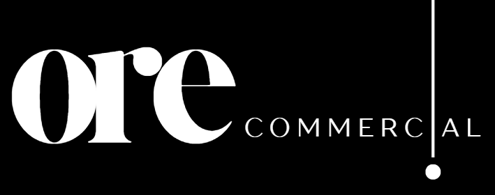 Minimalist white Ore Commercial brand logo featuring bold serif typography against a solid black background
