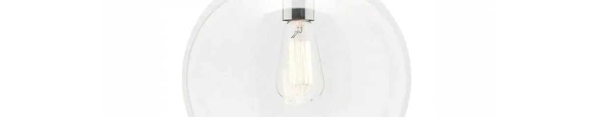 Clear glass globe pendant light with a polished chrome fitting and a visible vintage style filament bulb