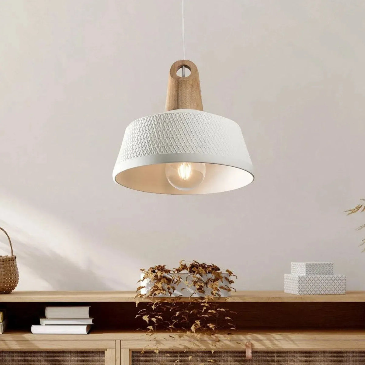 White textured ceramic pendant light with a timber top detail hanging above a wooden sideboard in a bright room