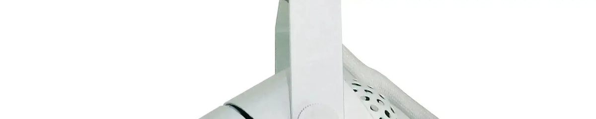 Polished chrome track head with a cylindrical shape and perforated ventilation holes mounted on a pivoting bracket