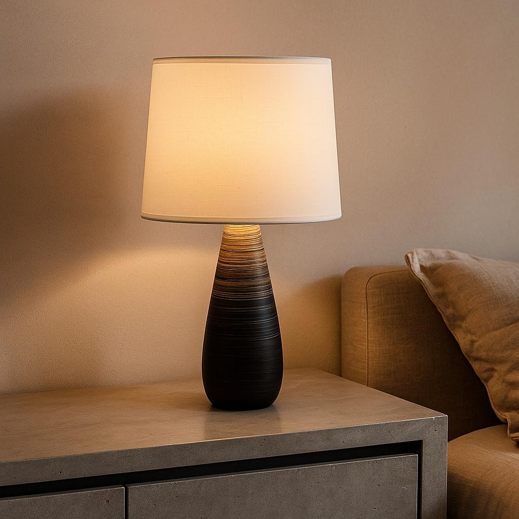 Sarah Charming ceramic table lamp with a brown textured base and white linen shade on a bedside table.